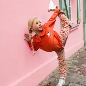 a red sweater with a white heart on it