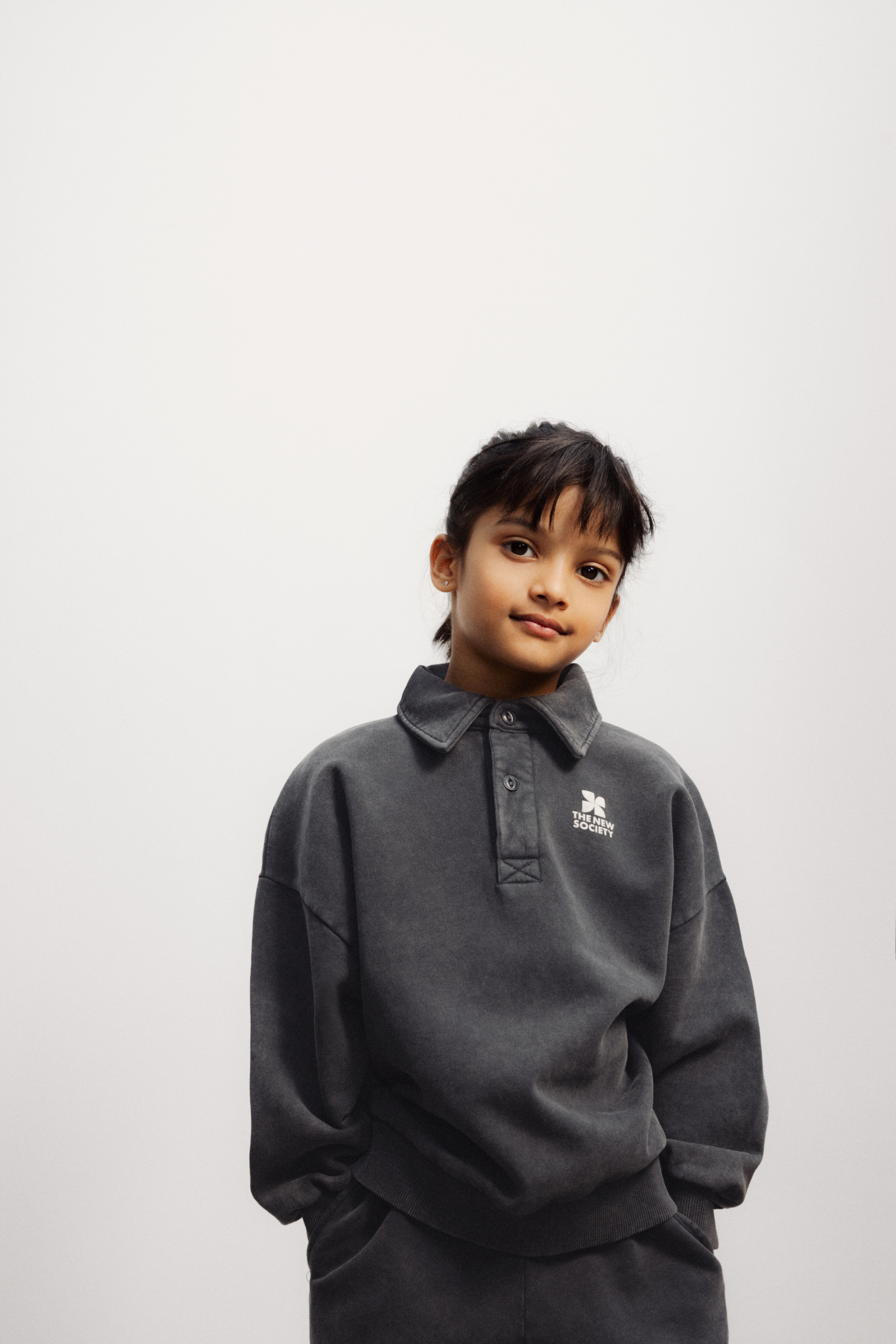 The New Society logo polo sweater forged iron sfeer