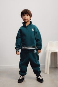 The New Society Whisper polo sweater dark sea